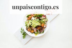 cooked food with sliced vegetables in white bowl