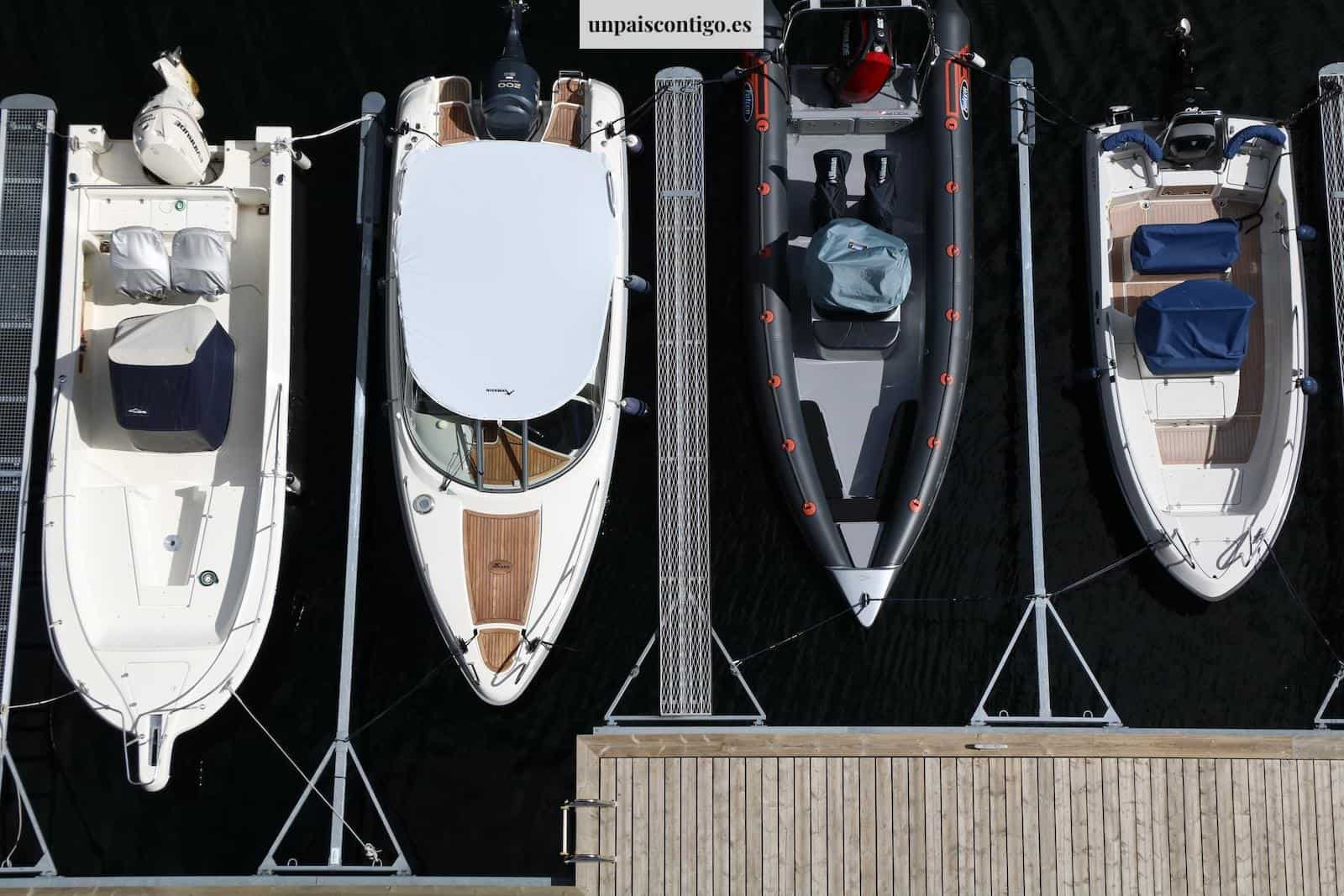 white and red boat on dock during daytime