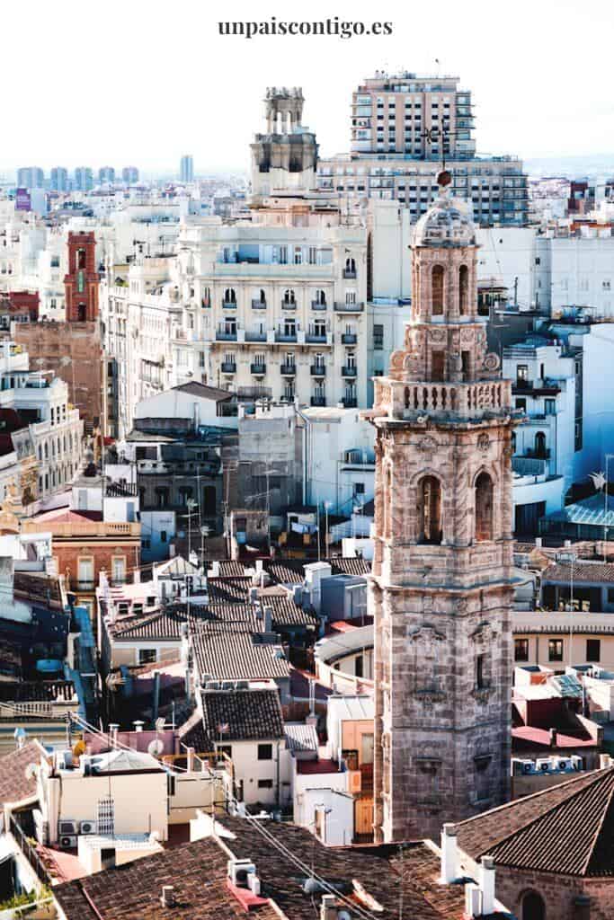 aerial photography of beige tower surrounded by houses during daytime
