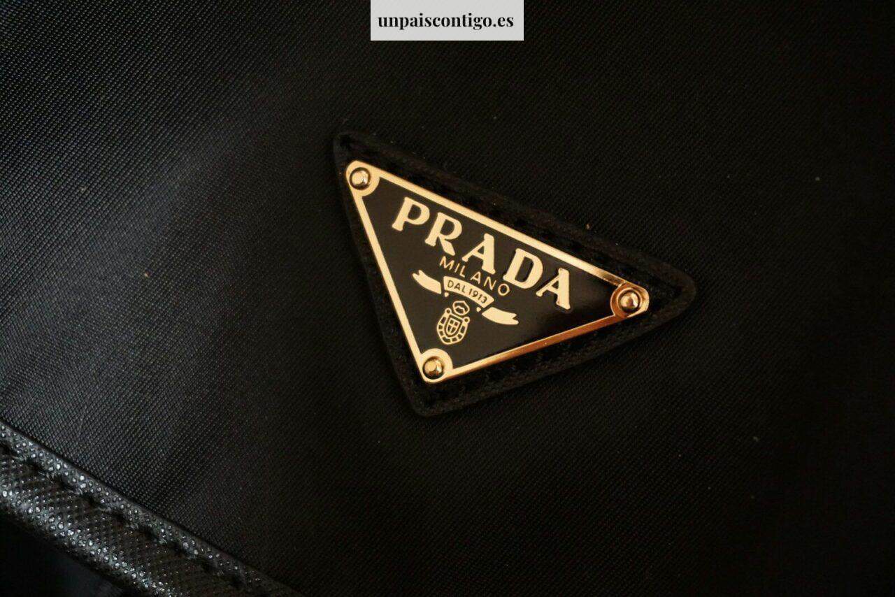 a prada logo on a black jacket