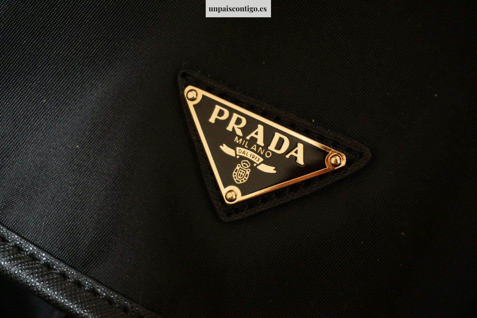 a prada logo on a black jacket